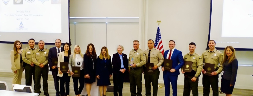 District Attorney Summer Stephan poses for photos with San Diego County Sheriff members honored with Cops of the Quarter Awards at One Safe Place: The North County Family Justice Center.