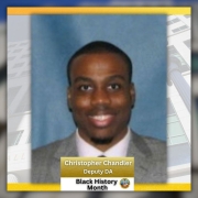 Photo of Deputy District Attorney Christopher Chandler for Black History Month. The Hall of Justice building is in the background of the photo.