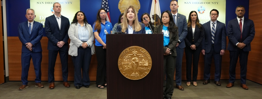 Photo of DA Summer Stephan at press conference announcing human trafficking and wage theft charges today against two defendants who were taking advantage of the immigration status of their workers, forcing them to work around the clock without the pay required under California laws.