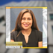 Portrait of Rebecca Gomez, Legal Support Manager, smiling in front of a blue background, with a caption reading “Rebecca Gomez” and “Legal Support Manager” and a badge stating “Hispanic Heritage Month.”