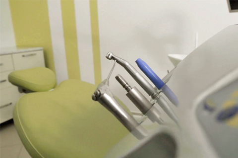 Photo of dentist chair and tools. Story: Dentist Charged for Fraudulently Billing Insurance Companies